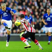Phil Neville crosses the ball during a Premier League match at the Stadium of Light on Boxing Day 2011