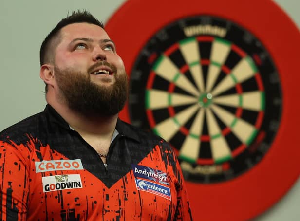 <p>Michael Smith of England celebrates beating Michael van Gerwen of Netherlands during Day Fourteen of the Cazoo World Darts Championship at Alexandra Palace. (Picture: Luke Walker/Getty Images)</p>
