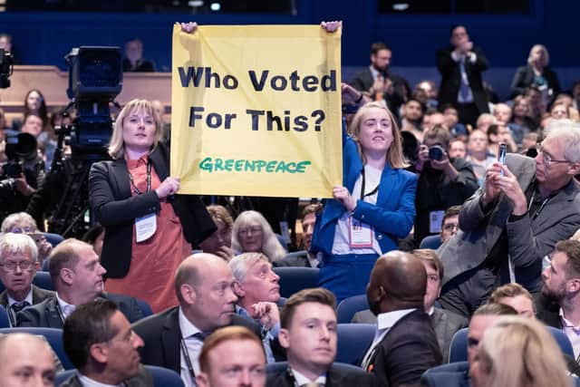 Greenpeace protesters interrupt Prime Minister Liz Truss as she delivers her keynote speech to the Conservative Party annual conference