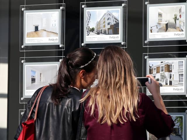 A couple of women studying the house price signs in an estate agents window. PIC: Yui Mok/PA Wire