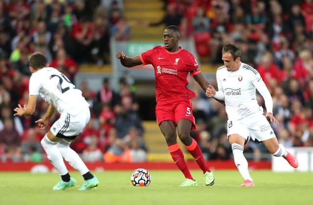 LIVERPOOL, ENGLAND - AUGUST 09: Ibrahima Konate of Liverpool battles for possession with Kike Garcia of Osasuna during the Pre-Season Friendly match between Liverpool and Osasuna at Anfield on August 09, 2021 in Liverpool, England. (Photo by Lewis Storey/Getty Images)