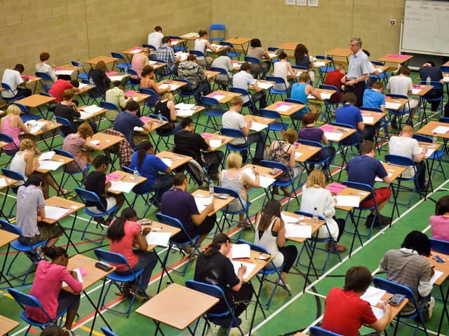 File photo dated 25/05/10 of students sitting an exam, as the Higher pass rate is down from last year but remains above 2019 levels, as more than 140,000 pupils across Scotland receive their exam results.