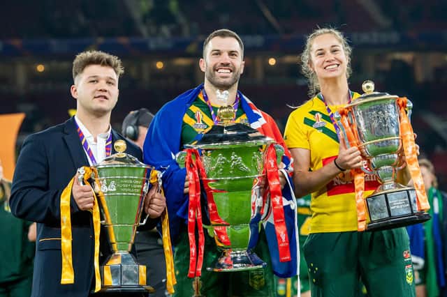 England's Tom Halliwell, Australia's James Tedesco and Kezie Apps with the respective wheelchair, men's & women's Rugby League World Cup trophies. (Photo: Allan McKenzie/SWpix.com)