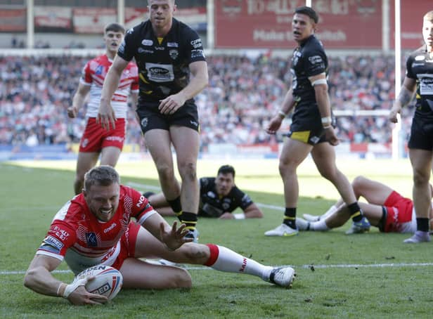 <p>St Helens' Joe Batchelor scores his side's second try of the game. Picture: Will Matthews/PA Wire.</p>