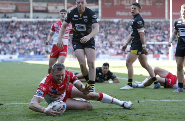 <p>St Helens' Joe Batchelor scores his side's second try of the game. Picture: Will Matthews/PA Wire.</p>