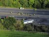 M53 crash: Schoolgirl and coach driver dead after school bus overturns on motorway