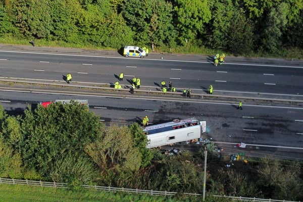 Emergency services at the scene of a coach crash on the M53 motorway. Photo: Peter Byrne/PA Wire