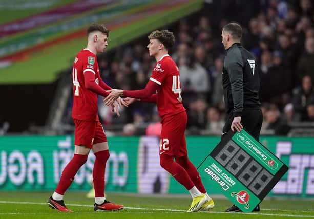 Liverpool's Conor Bradley (left) is replaced by substitute Bobby Clark during the Carabao Cup final at Wembley Stadium. (Photo by Adam Davy/PA Wire)
