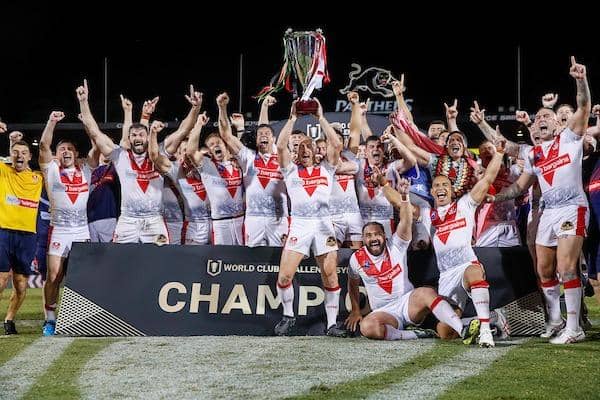 St Helens celebrate with the World Club Challenge Trophy after victory over Penrith. Picture by David Neilson/SWpix.com.