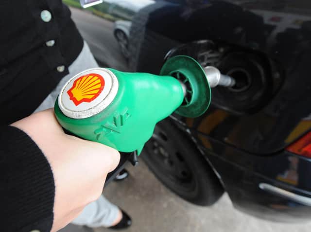 A person fills up at a Shell petrol station in Newcastle, as last-minute talks to avert a fuel strike began today, as 500 petrol tanker drivers prepare for a four-day walkout.
