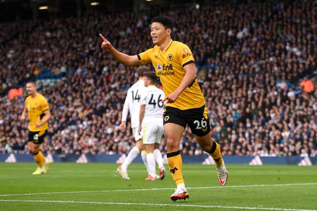 LEEDS, ENGLAND - OCTOBER 23: Hwang Hee-chan of Wolverhampton Wanderers celebrates after scoring their side's first goal during the Premier League match between Leeds United and Wolverhampton Wanderers at Elland Road on October 23, 2021 in Leeds, England. (Photo by Stu Forster/Getty Images)