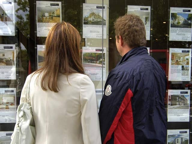 A couple outside an estate agent's window. Image: Tim Ireland/PA Wire