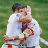 Tommy Makinson is congratulated on his try by Will Hopoate. (Photo: Alex Whitehead/SWpix.com)