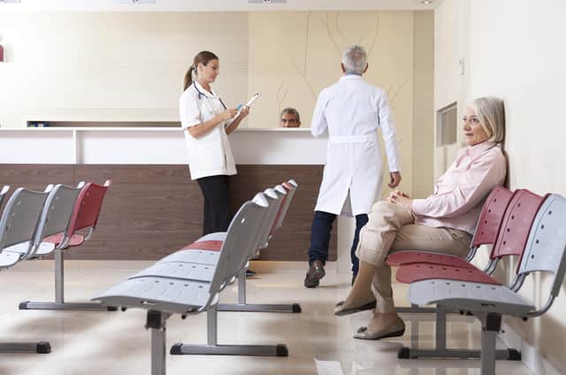 Doctors and patient in waiting room. (Shutterstock)