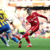 Max Woltman shoots during the Emirates FA Cup third round match between Liverpool and Shrewsbury Town at Anfield in January (photo by Clive Brunskill/Getty Images).