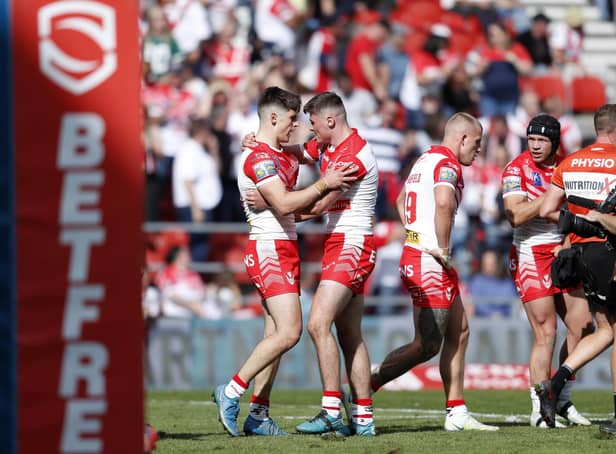 <p>St Helens' Jonathan Bennison (left) is congratulated by his team mates after scoring his side's third try of the game. Picture: Will Matthews/PA Wire.</p>