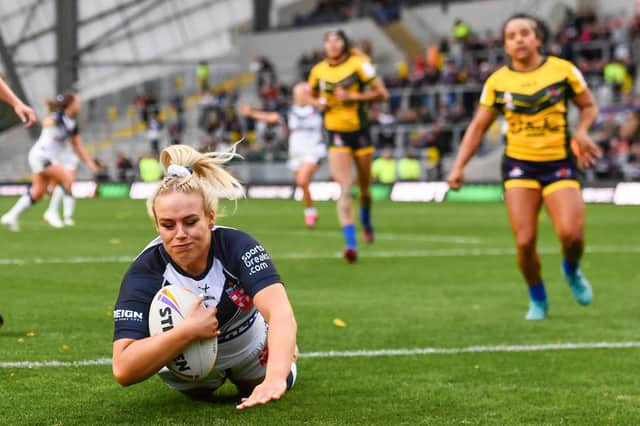 <p>Amy Hardcastle of England breaks through to score her sides fifth try against Brazil (Picture: Will Palmer/SWpix.com)</p>